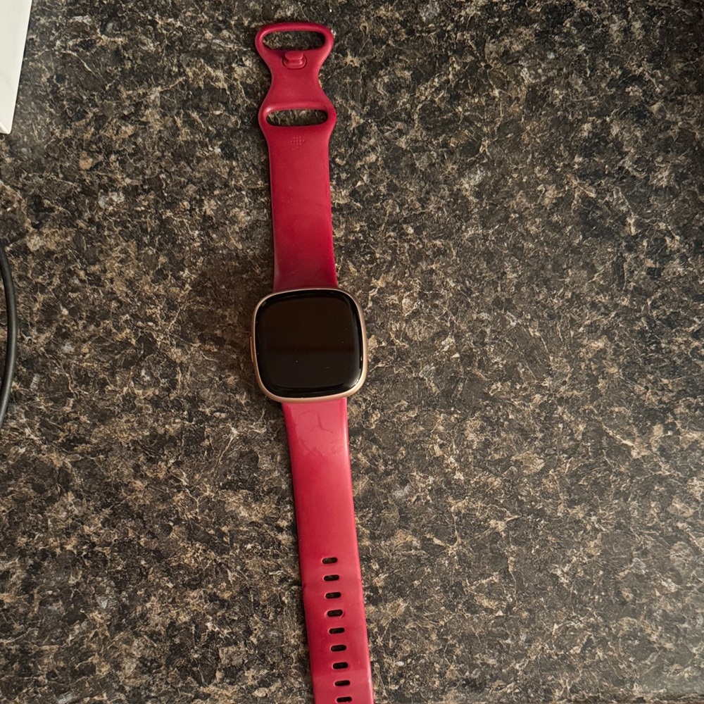 Fitbit versa 4 with purple band